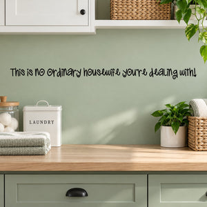 Wall decal with humorous quote: “This is no ordinary housewife you’re dealing with”.