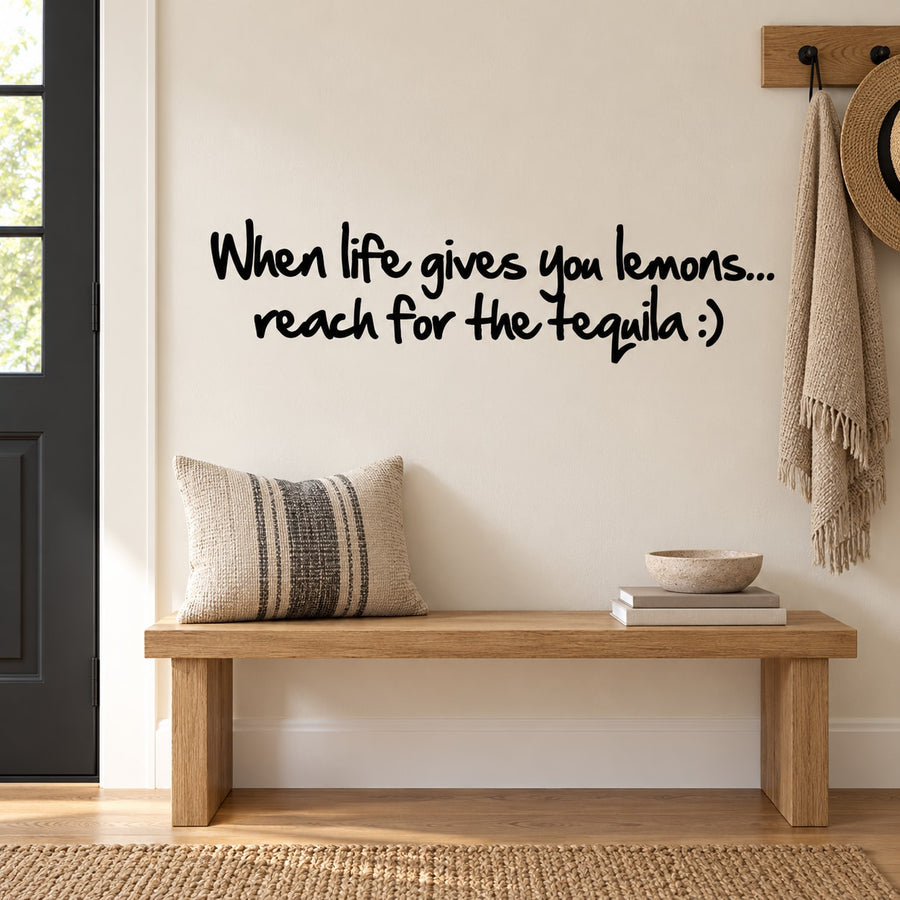 Wall quote decal with black cursive: “When life gives you lemons... reach for the tequila.”