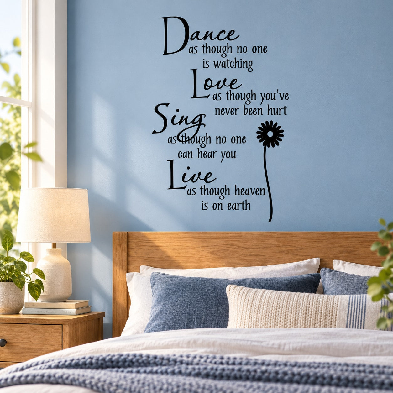 Inspirational wall decal with black script quote and small flower accent