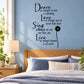 Inspirational wall decal with black script quote and small flower accent