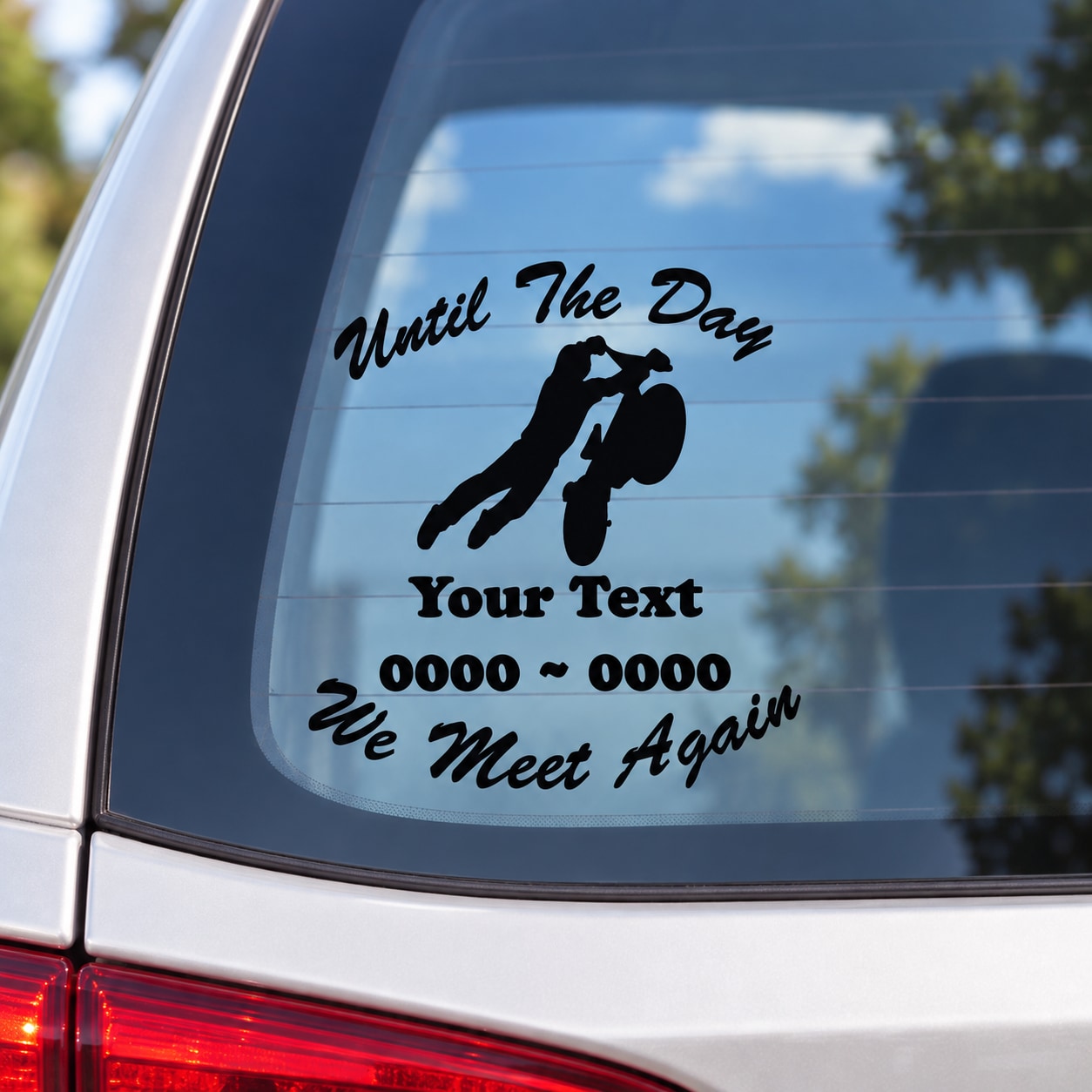 Memorial car window decal with biker silhouette and black custom text