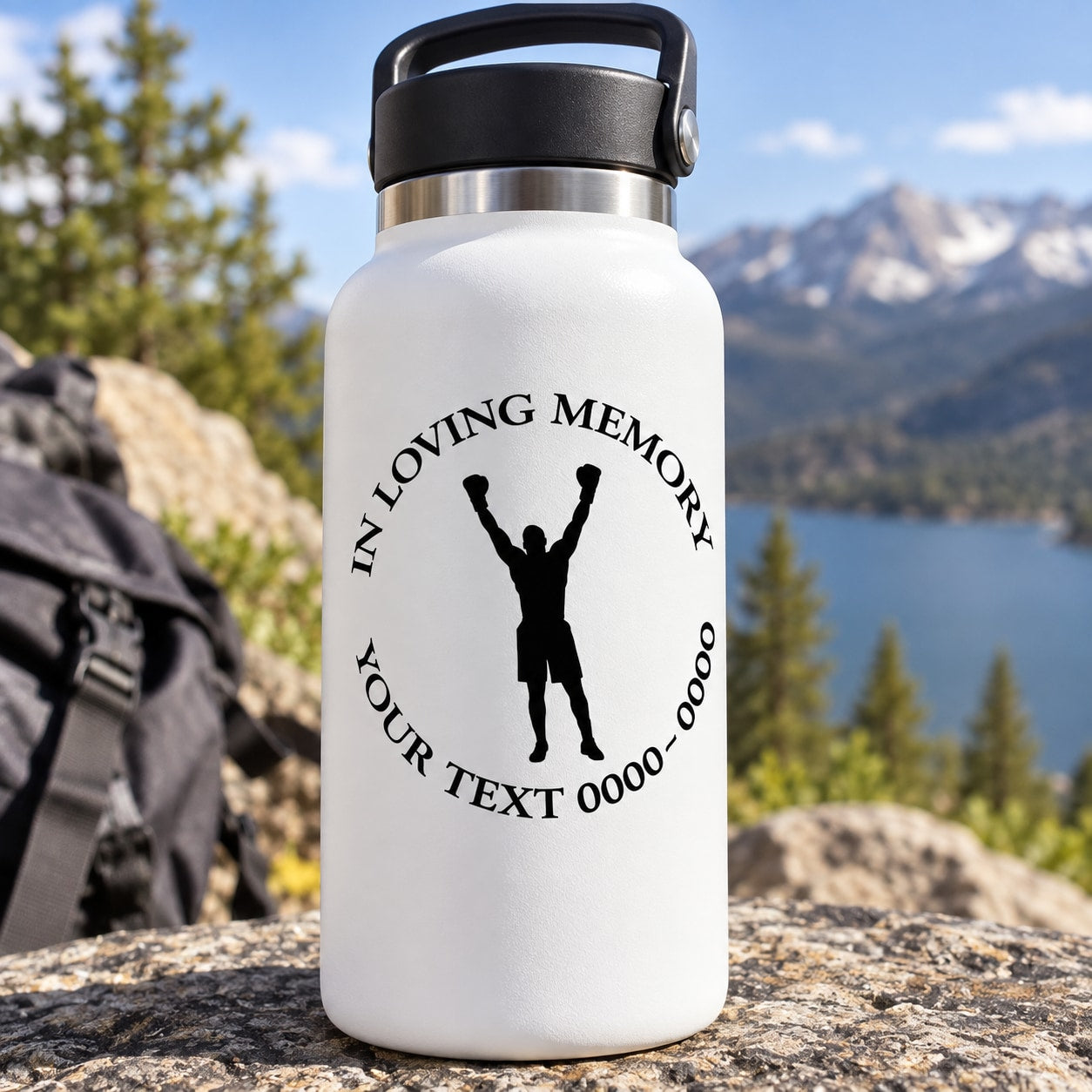 White water bottle with black In Loving Memory decal and silhouette boxer arms raised