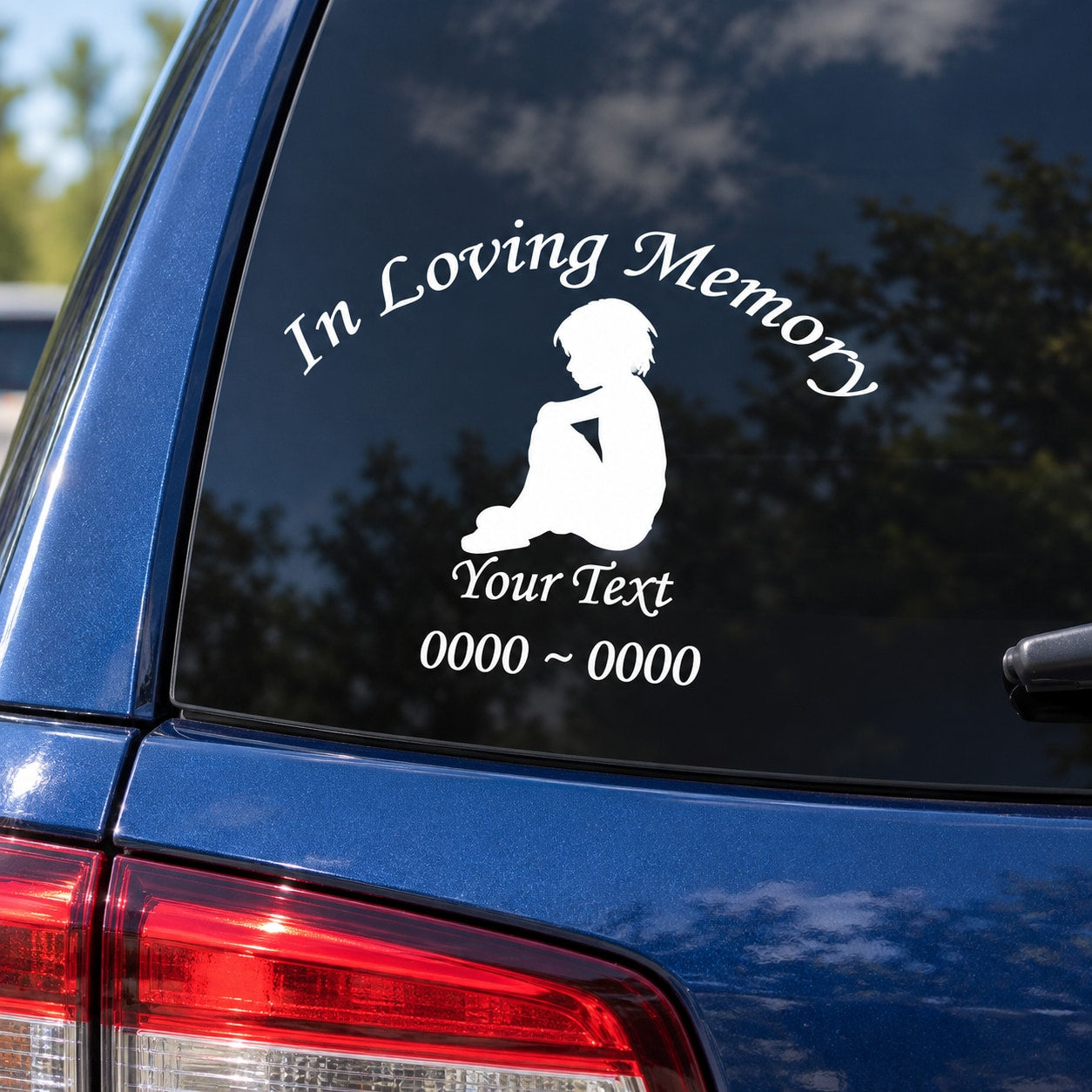 Car window memorial decal with boy silhouette and 'In Loving Memory' text