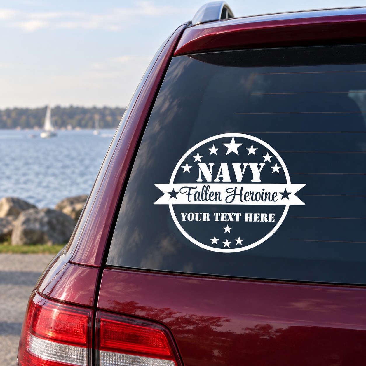 Navy fallen heroine memorial decal on car rear window, circular stars and text design
