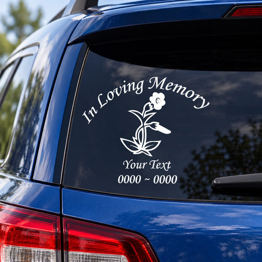 Car window decal with “In Loving Memory” text and flower graphic