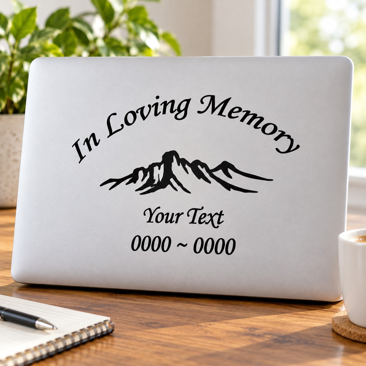 In loving memory decal with mountain graphic, custom text, and date range on white
