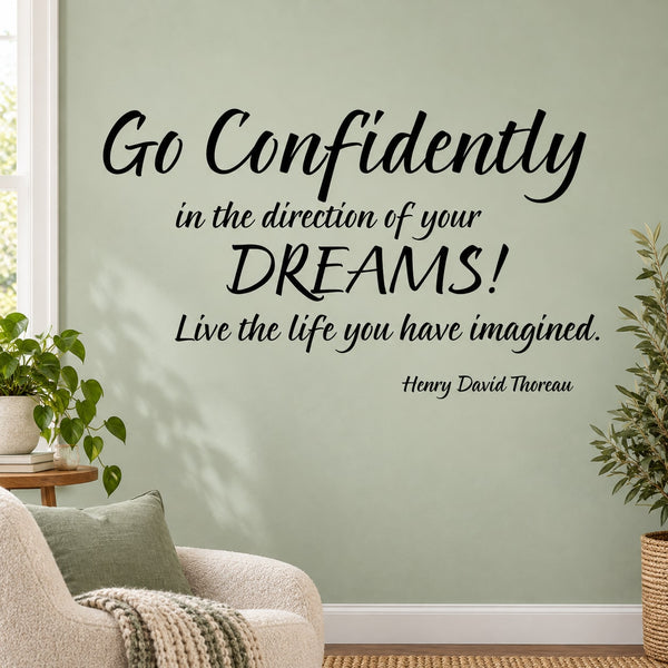 Wall decal with black cursive quote: Go confidently toward your dreams, Henry David Thoreau