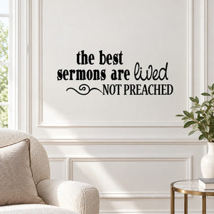 Wall decal with black text: “the best sermons are lived, not preached” with decorative flourish