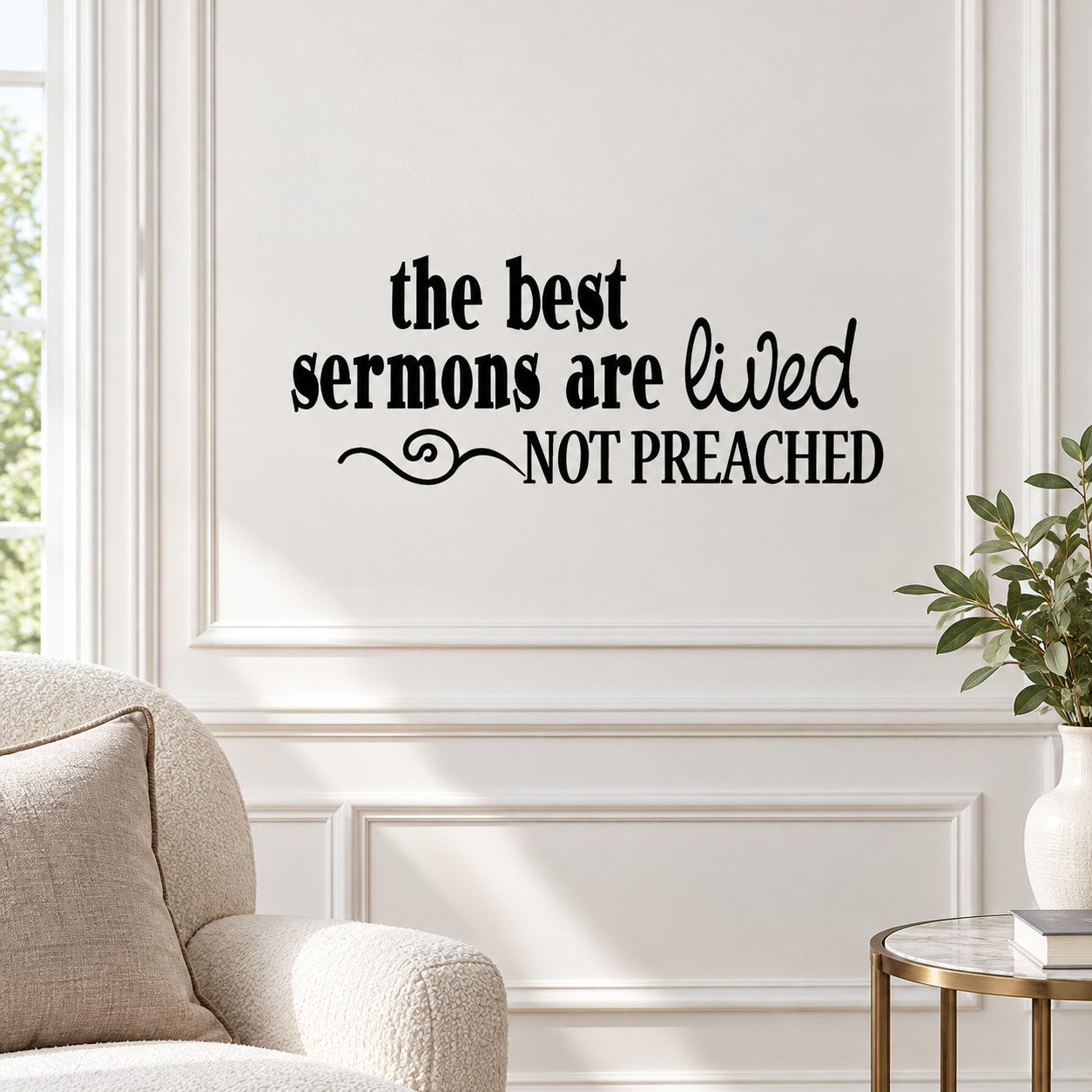 Wall decal with black text: “the best sermons are lived, not preached” with decorative flourish
