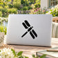 Simple dragonfly decal sticker, black icon on light laptop lid