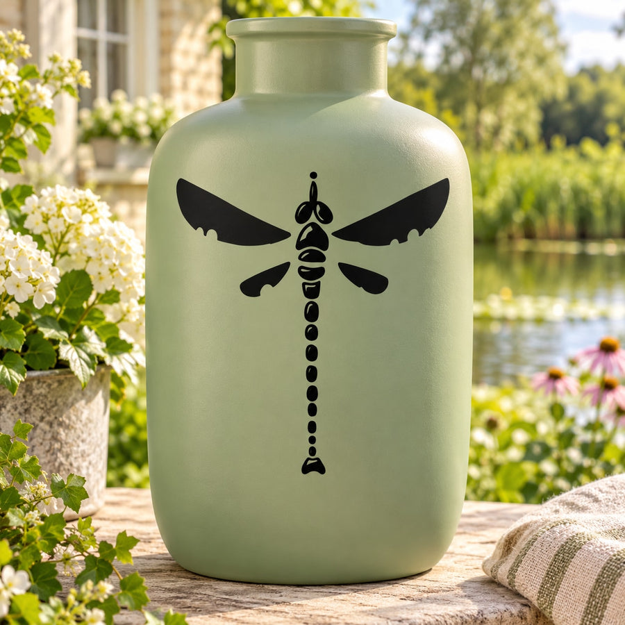 Beaded dragonfly decal with black winged silhouette and bead-style center design