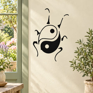 Yin-yang insect wall decal with black linework and two circular eye dots