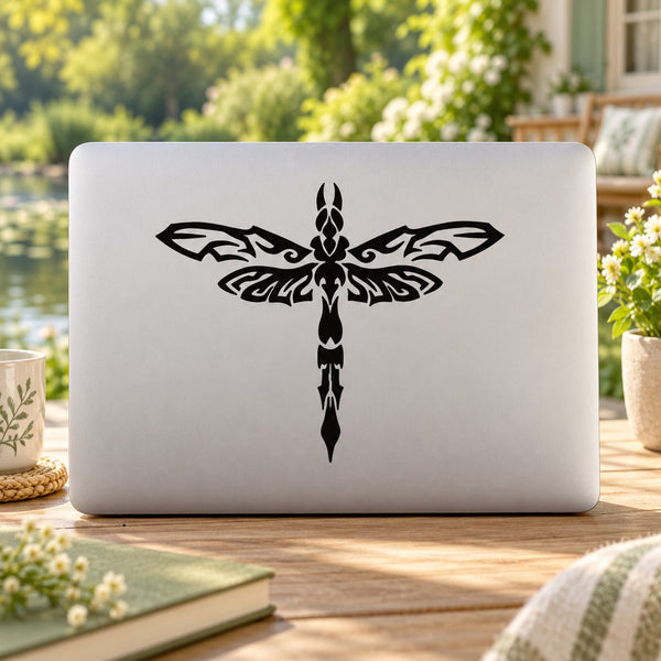 Black dragonfly stencil decal with mirrored wings on light laptop lid
