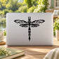 Black dragonfly stencil decal with mirrored wings on light laptop lid