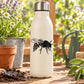 Wasp harvesting decal with black wasp illustration on a white bottle