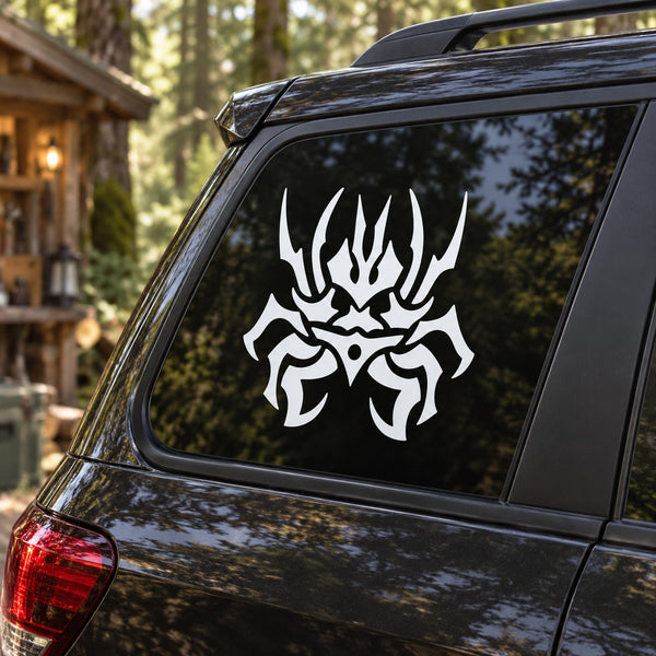 White abstract insect decal on rear car window