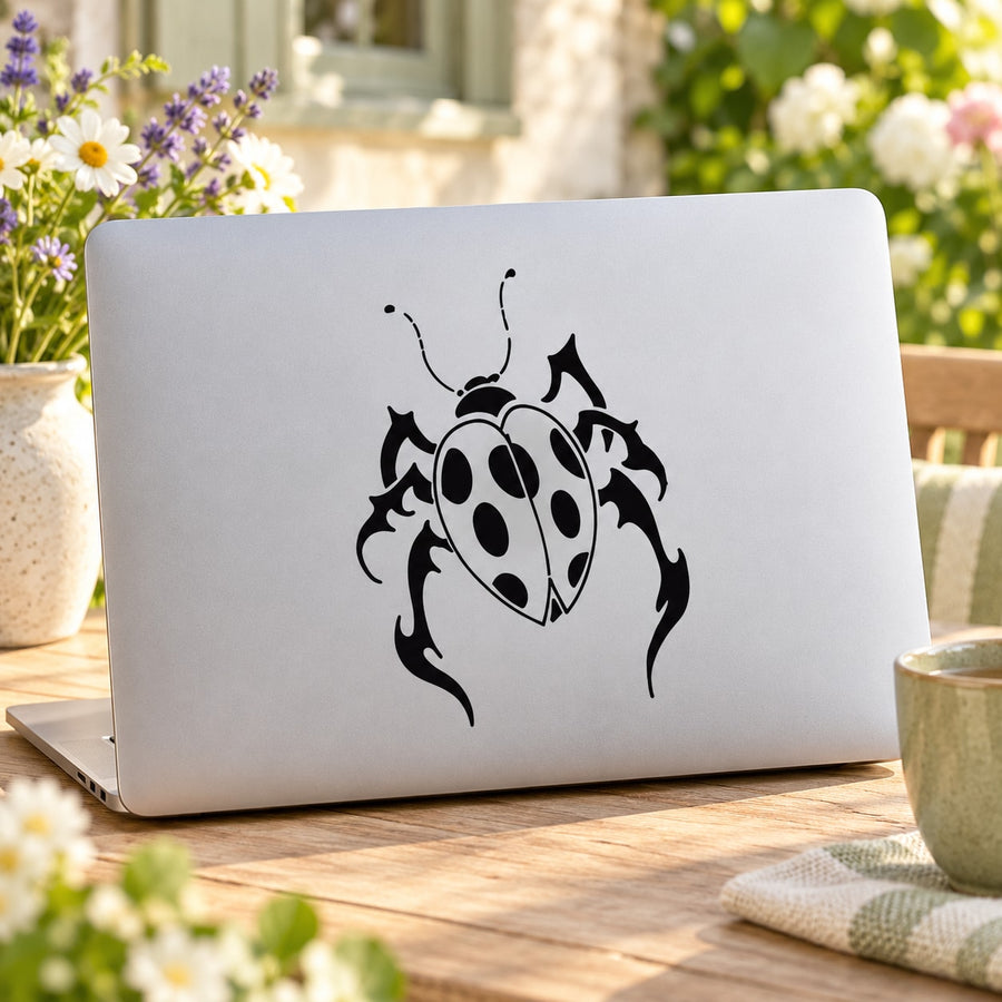 Ladybug decal sticker with black graphic, antennae and spots on white surface