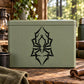 Geometric spider decal: black geometric emblem on light green rectangular surface