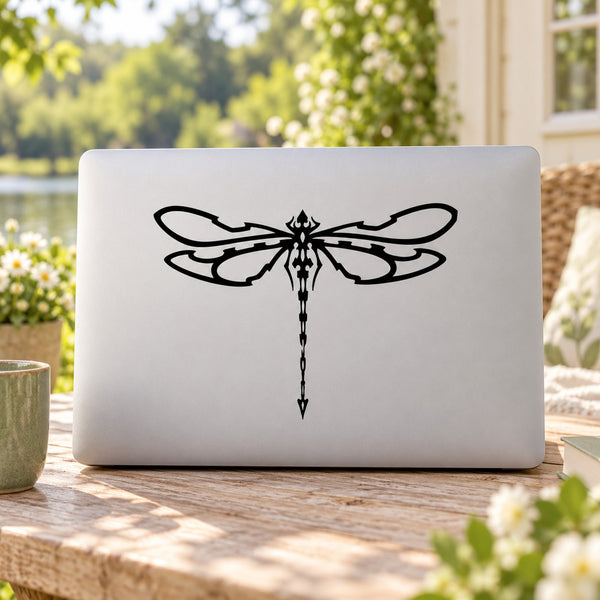 Beaded dragonfly wing decal with long tail, black outline on light surface