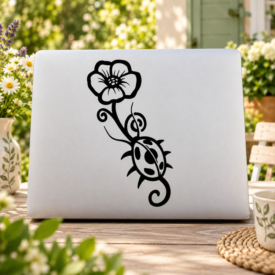 Black ladybug crawling on flower vinyl decal on white rectangular backing