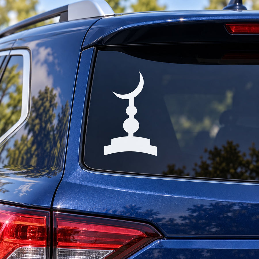 Crescent moon and minaret graphic decal on dark car window panel