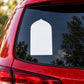 White mosque window decal shaped like an arched window on a car side window.