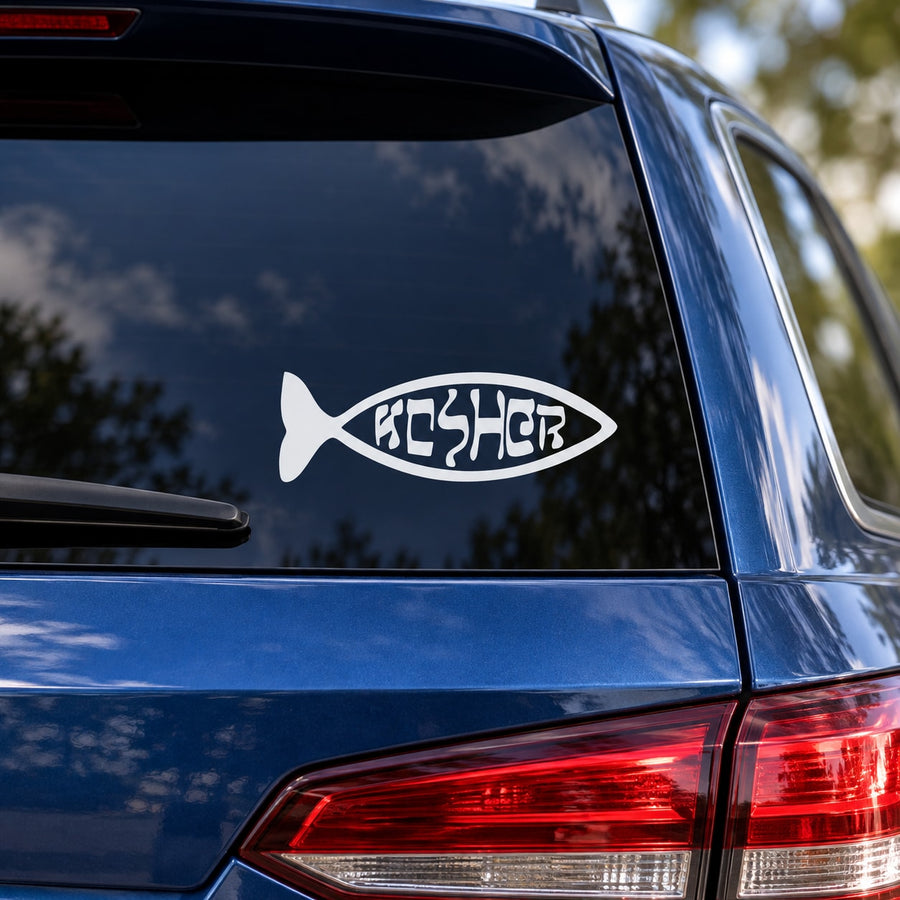 Fish-shaped kosher decal with Hebrew lettering on a car window