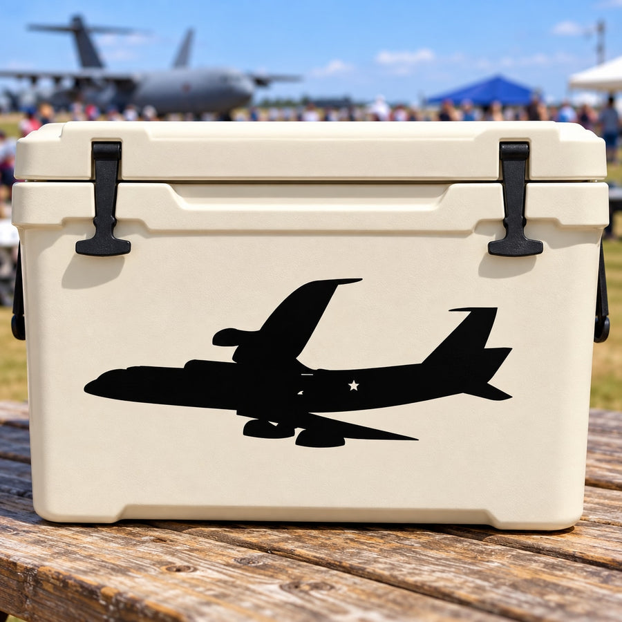Airplane decal with bold black silhouette on off-white surface