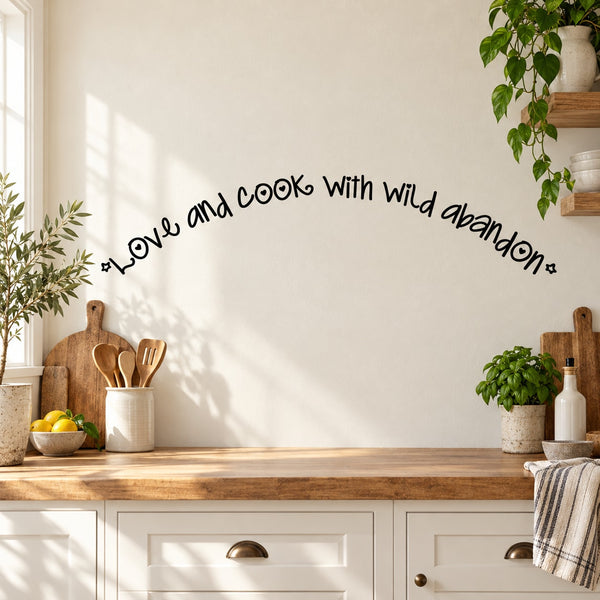 Wall decal with cursive text: "Love and cook With wild abandon!"