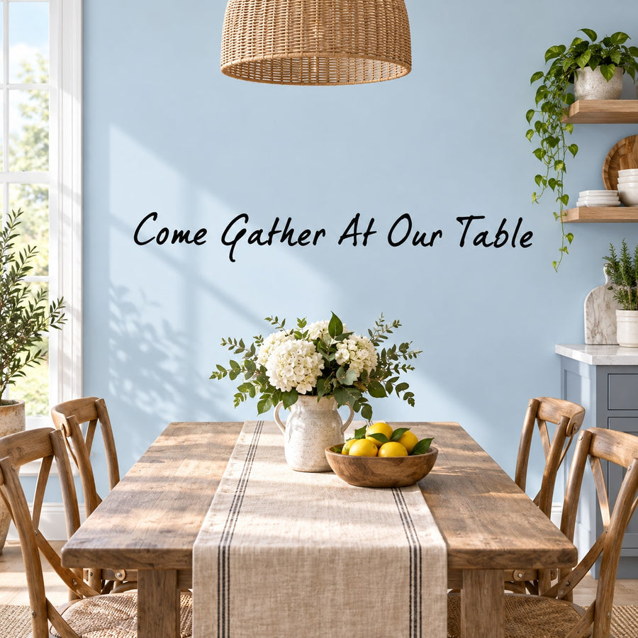 Wall decal: cursive “Come Gather At Our Table” with small green floral vine accents