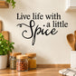 Black wall decal lettering: "Live life with a little Spice"