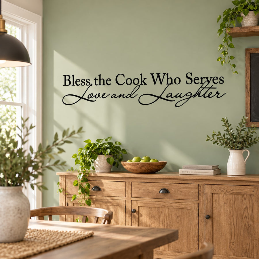 Wall decal: 'Bless the Cook Who Serves Love and Laughter' in script.