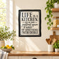 Square wall decal with black border and text: "LIFE IS A KITCHEN"
