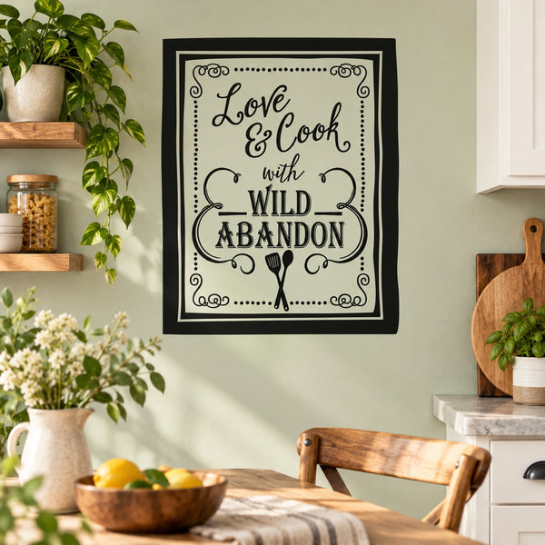 Kitchen wall decal with "Love & Cook with Wild Abandon" in decorative black frame