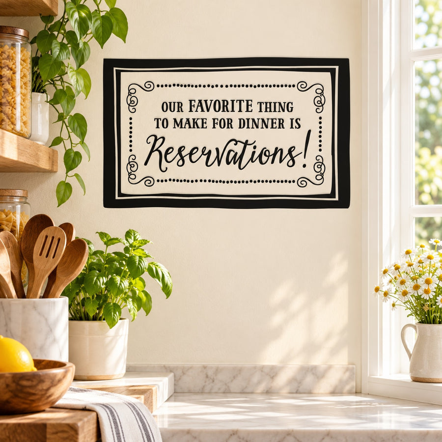 Wall decal with black frame: “Our favorite thing to make for dinner is Reservations!”