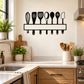 Kitchen utensil wall decal featuring black utensil icons on a hanging rack