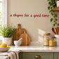 Red cursive wall decal text: “a thyme for a good time”