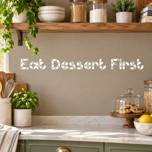 Wall decal with text 'Eat Dessert First' in decorative lettering