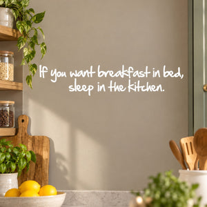 Kitchen wall decal with white cursive quote: If you want breakfast in bed, sleep in the kitchen.