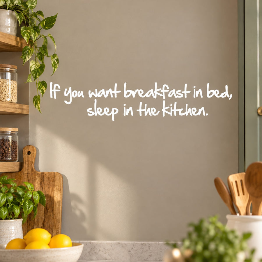 Kitchen wall decal with white cursive quote: If you want breakfast in bed, sleep in the kitchen.
