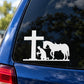 White vehicle decal with cross, praying cowboy silhouette, and horse