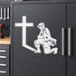 White wall decal of kneeling praying soldier with cross on dark surface