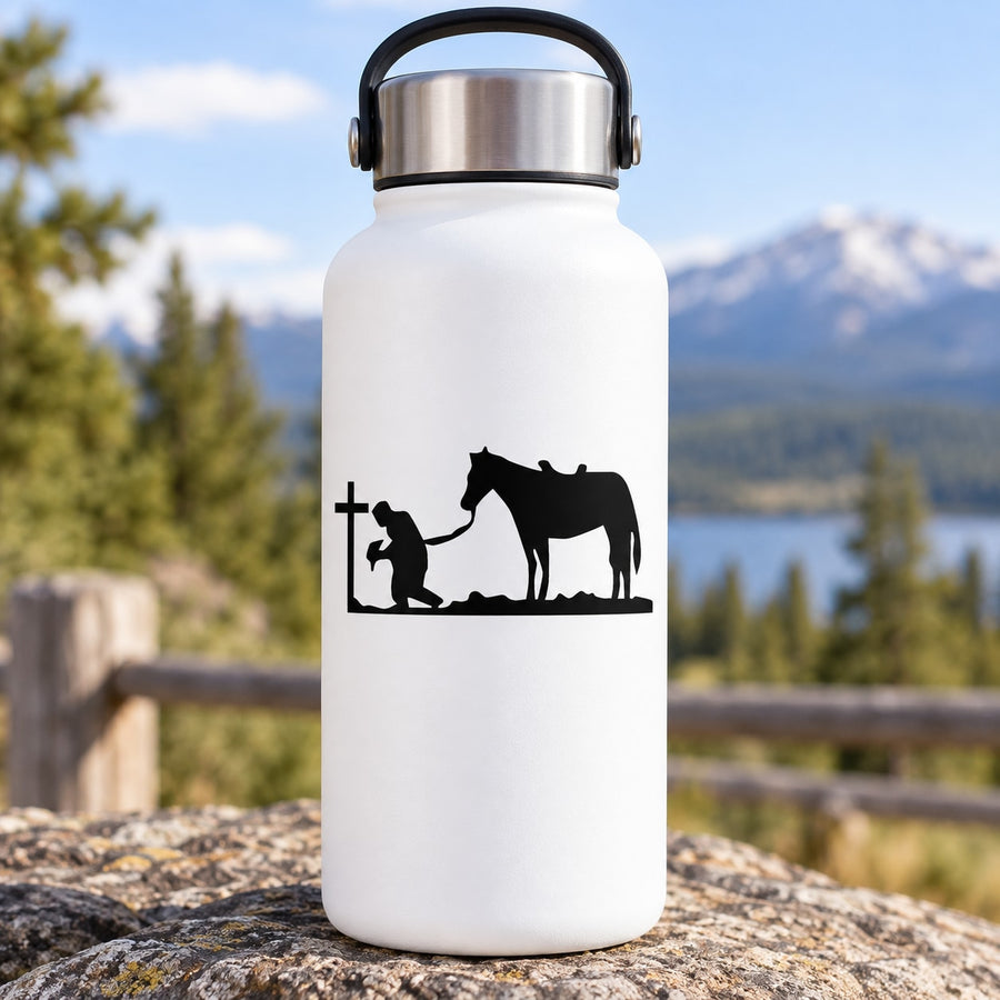 White bottle with black cowboy kneeling praying and horse decal