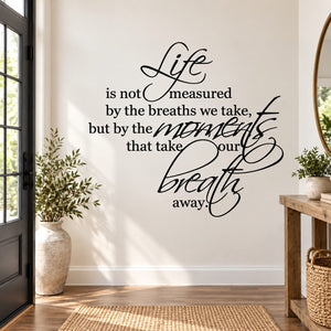 Black cursive quote wall decal: Life is not measured by the breaths we take