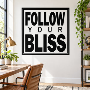 Square wall decal with bold black text: “FOLLOW YOUR BLISS” in a border frame