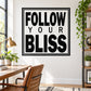 Square wall decal with bold black text: “FOLLOW YOUR BLISS” in a border frame