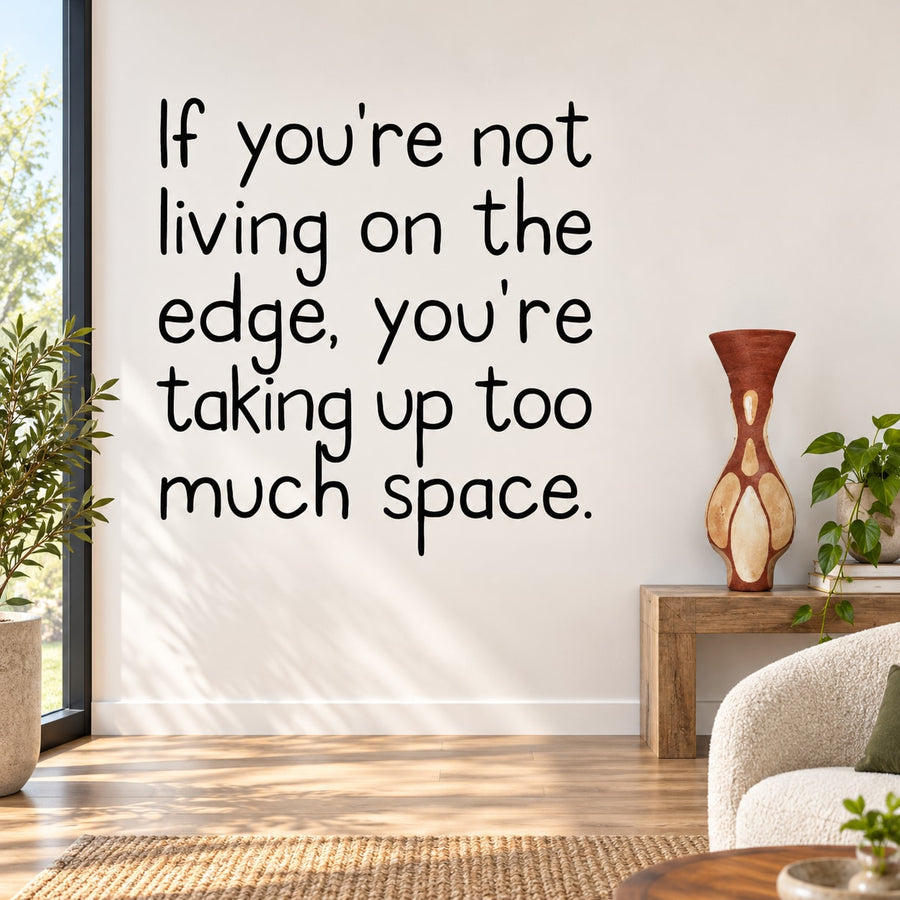 Wall decal with bold black quote: “Not living on the edge, taking up too much space.”