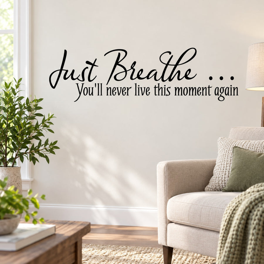 Wall decal quote 'Just Breathe...' in black cursive lettering with ellipsis