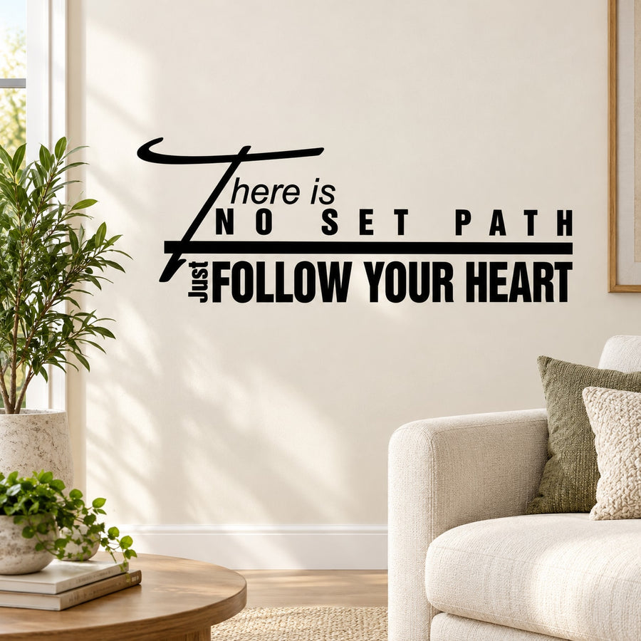 Black wall decal with quote: “There is no set path, follow your heart”