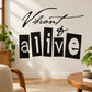 Black and white wall decal with 'Vibrant' script and 'alive' large block text